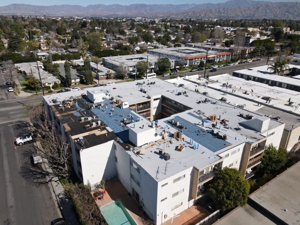 GCR replaced the roof of this apartment complex with a light-colored cool roof suitable for a commercial flat roof.